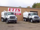 Two Beautiful White Water Trucks In Front Of The ETTS Shop